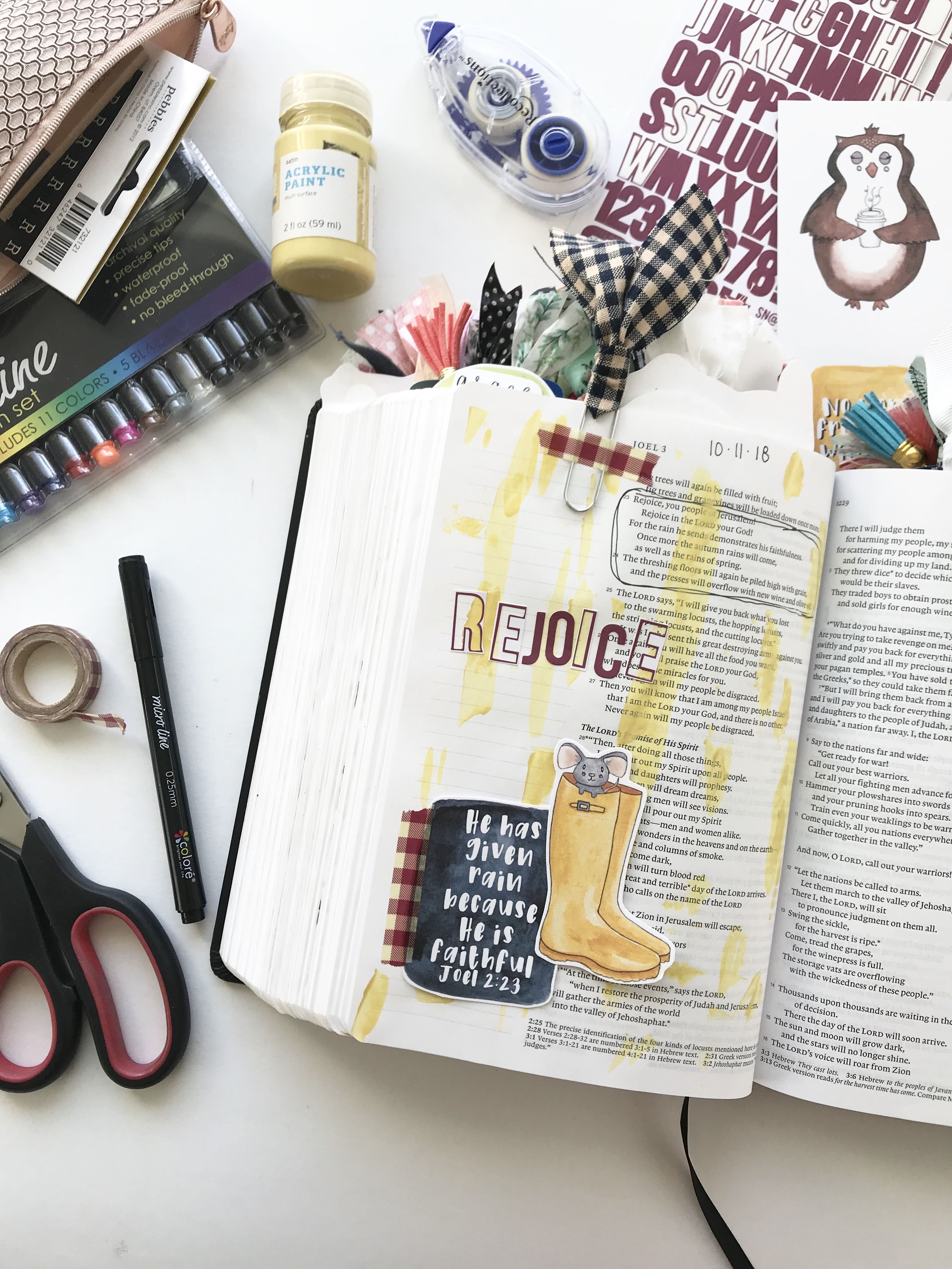 Bible journaling with acrylic paint, alpha stickers, washi tape, page clips, printables and pens.